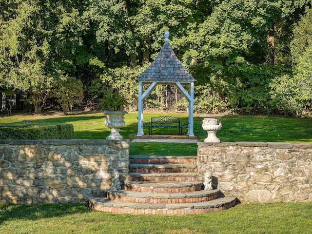 view of community with a yard and a gazebo