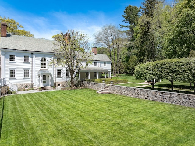 177 Old Briarcliff Rd, Briarcliff Manor, NY 10510 - exterior space featuring a lawn and a chimney