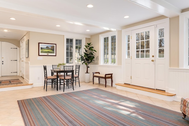 177 Old Briarcliff Rd, Briarcliff Manor, NY 10510 - interior space with beam ceiling, a decorative wall, tile patterned floors, a wainscoted wall, and recessed lighting