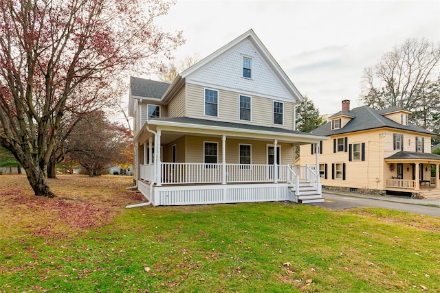 farmhouse-style home with a porch and a front yard