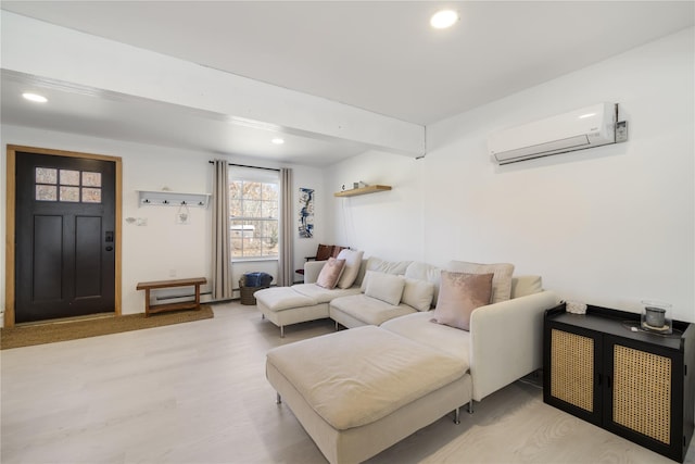 living room with light hardwood / wood-style flooring and a wall mounted AC