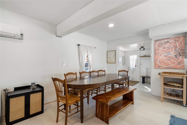 dining area with a wall mounted AC, plenty of natural light, and beamed ceiling