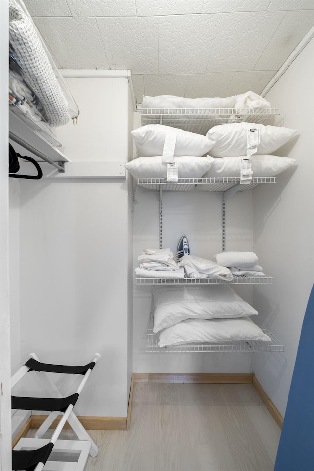 walk in closet featuring wood-type flooring