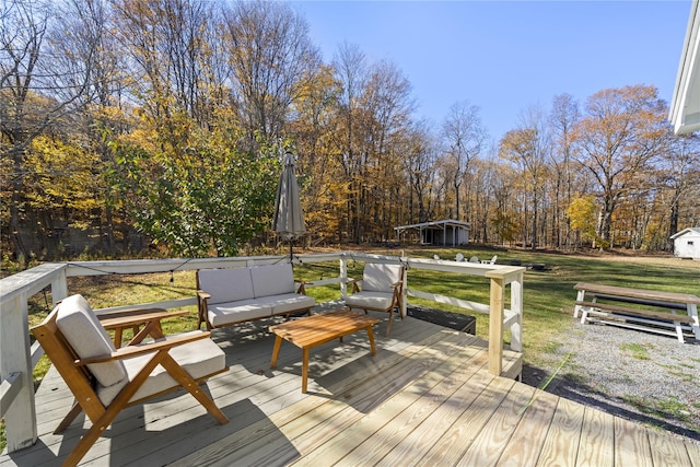 wooden terrace with a lawn and an outdoor living space