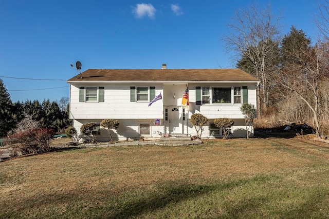 bi-level home with a front yard