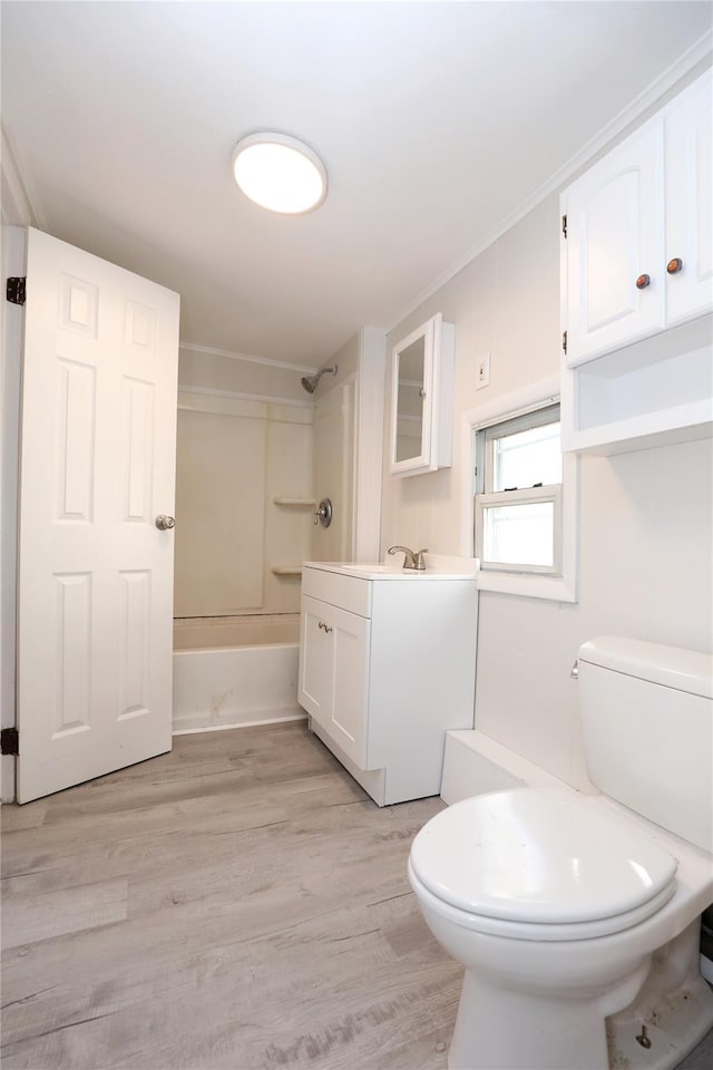 full bathroom with vanity,  shower combination, toilet, and wood finished floors