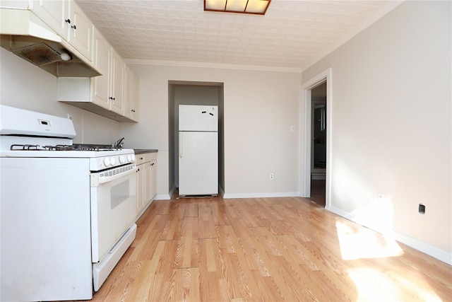 kitchen with under cabinet range hood, light wood finished floors, white appliances, and white cabinetry