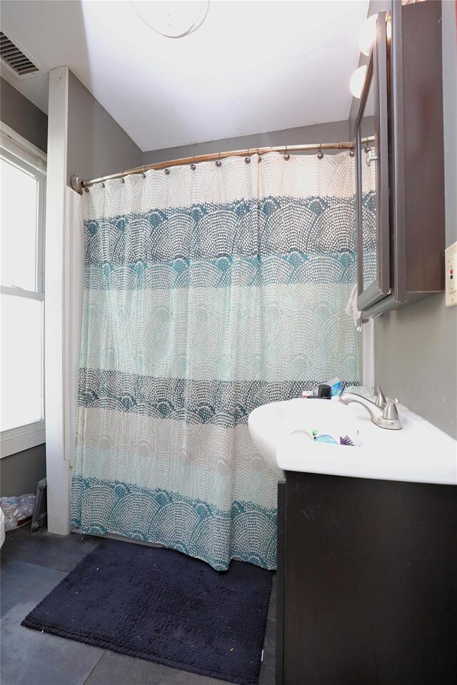 bathroom with tile patterned flooring, visible vents, vanity, and a shower with shower curtain