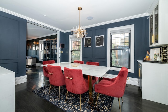 dining area with dark hardwood / wood-style floors, ornamental molding, and a notable chandelier