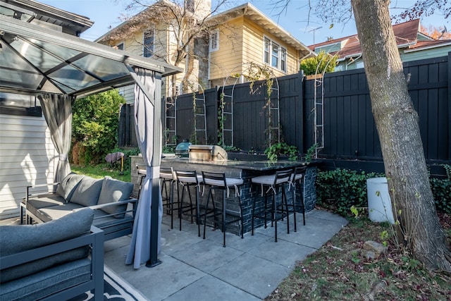 view of patio with a bar