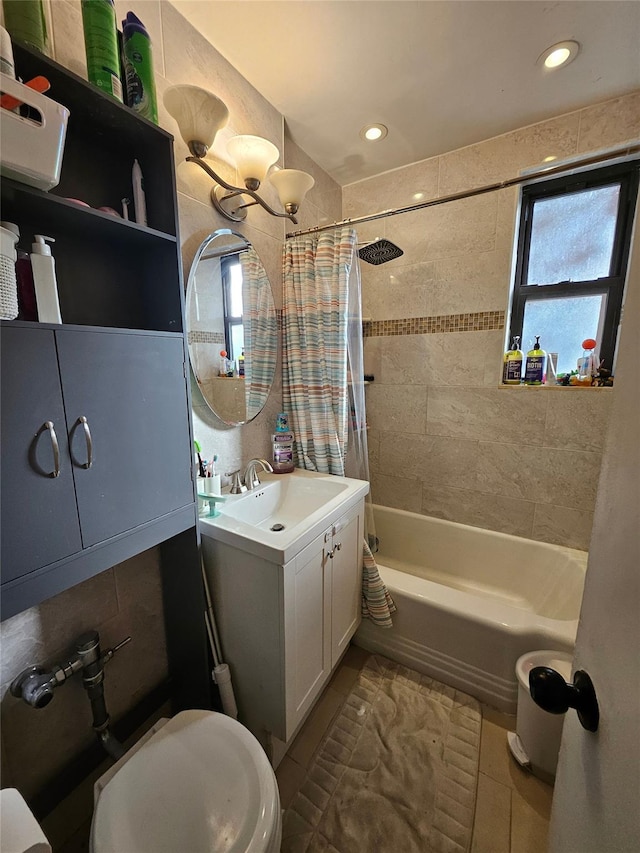 full bathroom featuring shower / tub combo, tile patterned floors, vanity, an inviting chandelier, and toilet