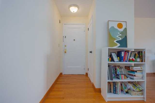 hall with light hardwood / wood-style flooring