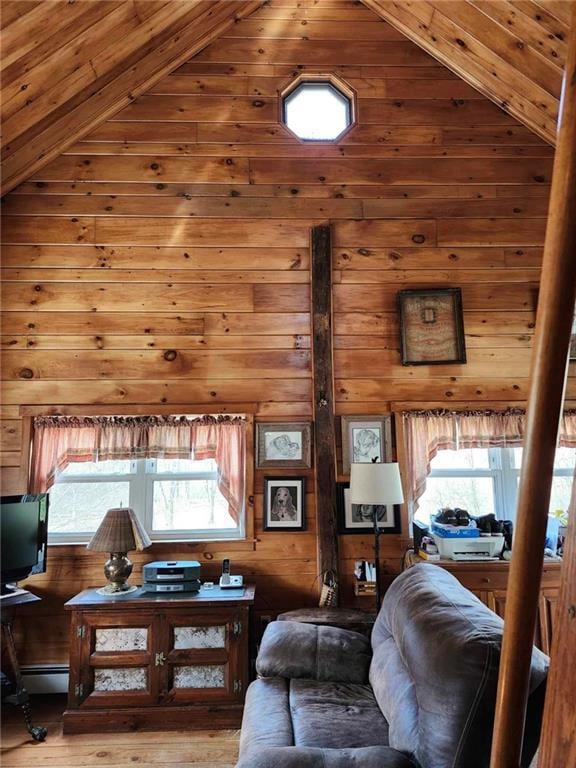 living room featuring plenty of natural light, light wood-type flooring, and vaulted ceiling