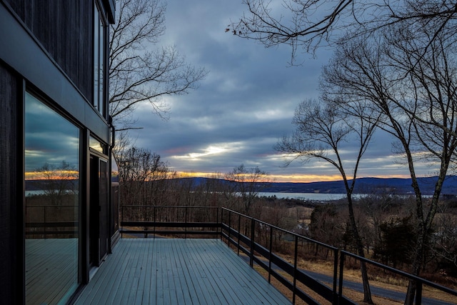 deck at dusk with a mountain view