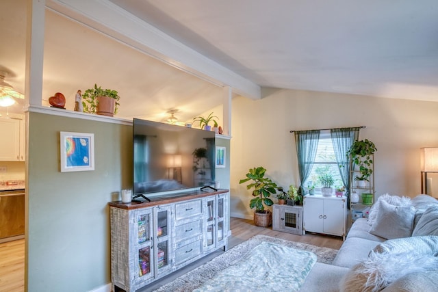 living room featuring lofted ceiling with beams, light hardwood / wood-style floors, and ceiling fan