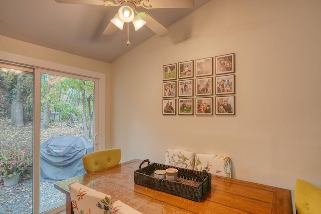 dining area featuring vaulted ceiling and ceiling fan