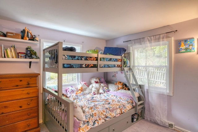 bedroom featuring light carpet