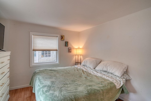 bedroom with light hardwood / wood-style flooring