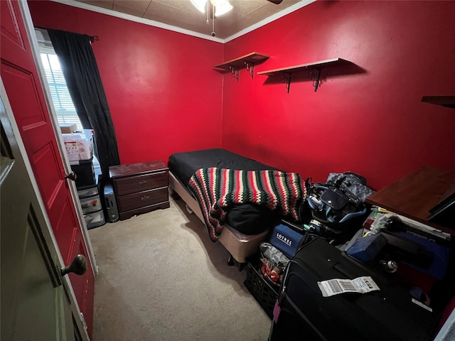 bedroom with crown molding, carpet, and ceiling fan