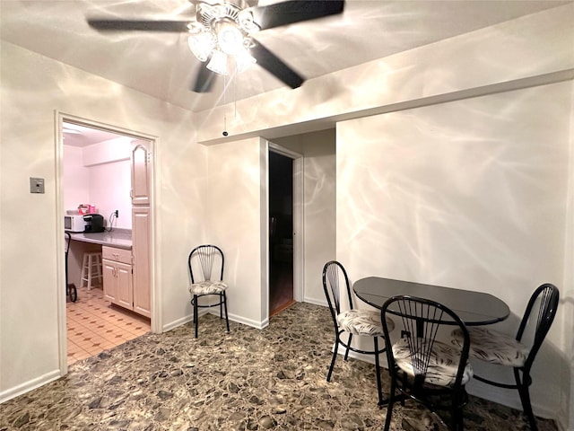 dining space with ceiling fan