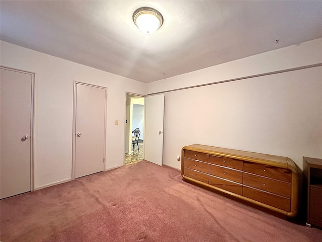 unfurnished bedroom with carpet flooring