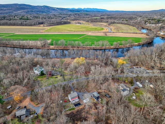 bird's eye view with a rural view and a water and mountain view