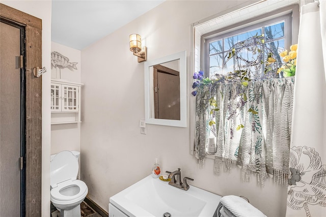 bathroom with vanity and toilet