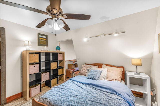 bedroom featuring ceiling fan and hardwood / wood-style floors