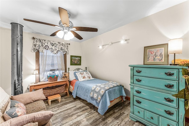 bedroom with dark hardwood / wood-style floors, ceiling fan, and lofted ceiling