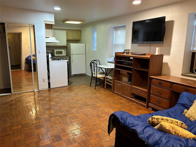 living room featuring dark parquet floors