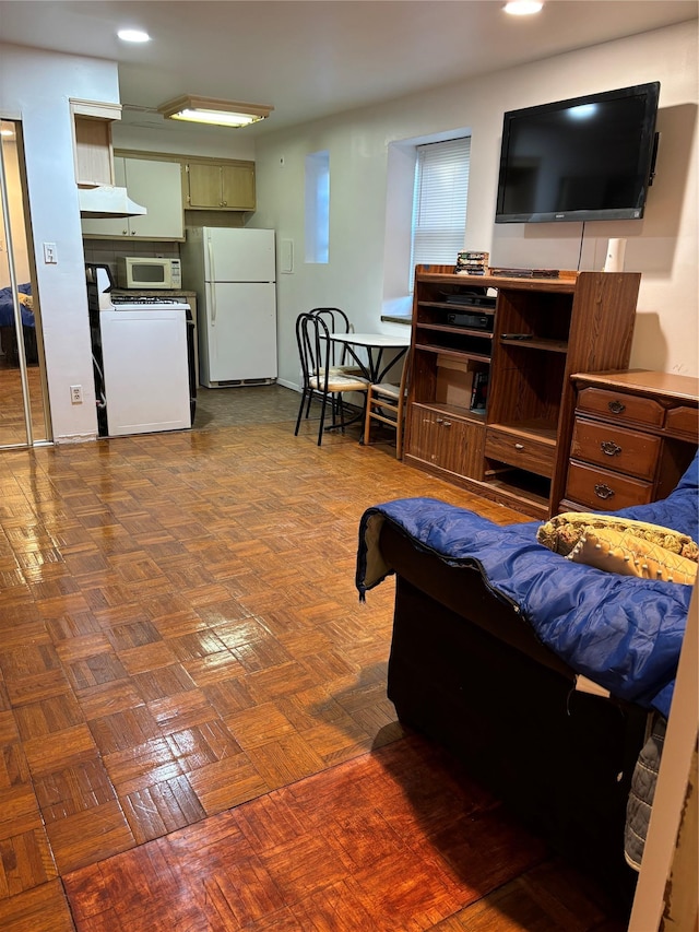 living room featuring dark parquet floors