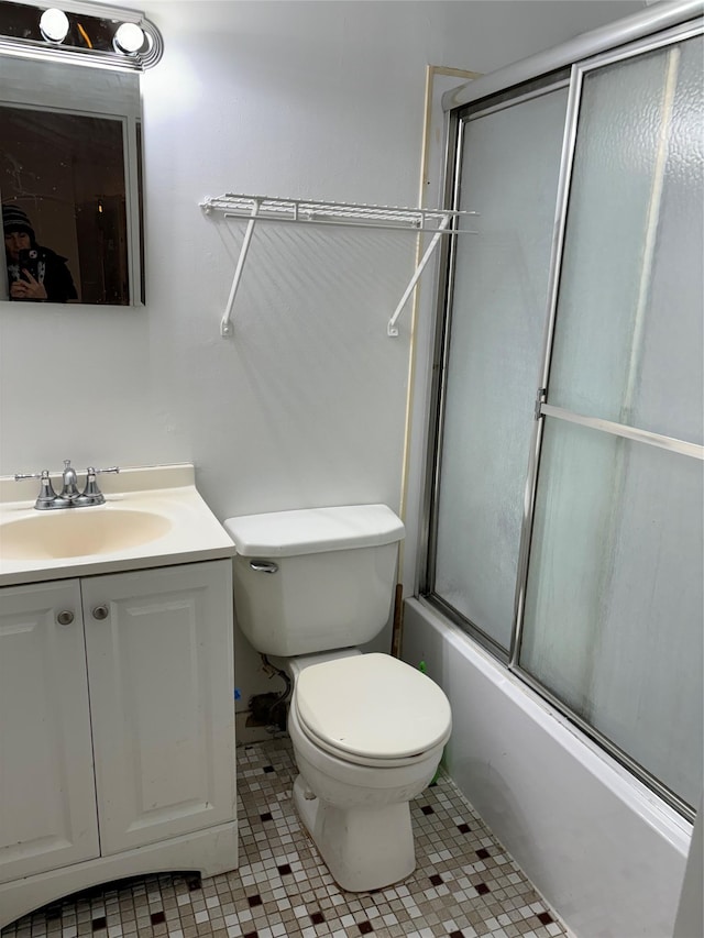 full bathroom with tile patterned flooring, vanity, toilet, and enclosed tub / shower combo