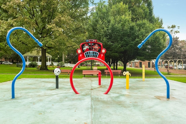 view of jungle gym with a lawn