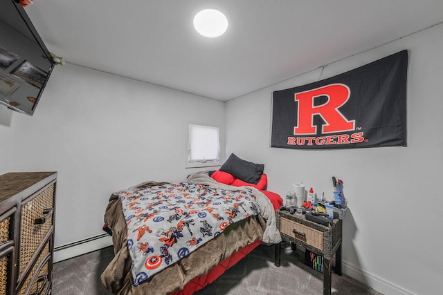 bedroom featuring carpet and a baseboard heating unit