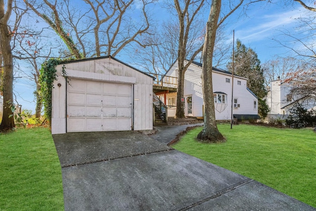 view of front facade with a garage and a front lawn