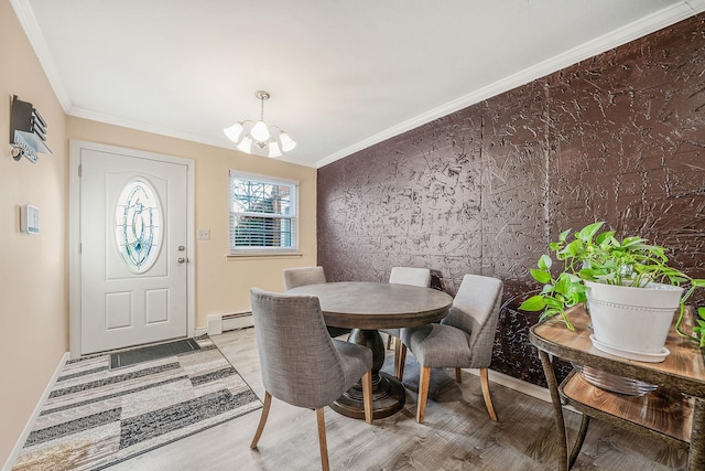 dining space with a chandelier, light hardwood / wood-style floors, a baseboard radiator, and crown molding