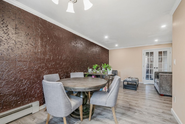 dining room featuring light hardwood / wood-style floors, french doors, ornamental molding, and a baseboard radiator