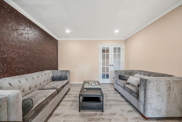 living room with crown molding, light hardwood / wood-style flooring, and french doors