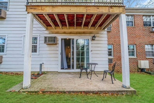 rear view of property featuring a patio and a lawn