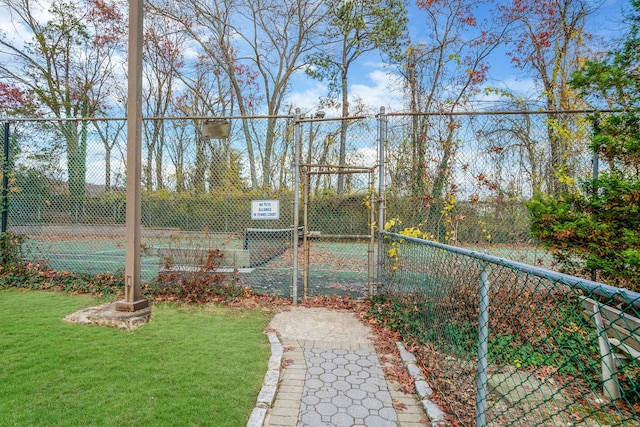 view of yard featuring tennis court