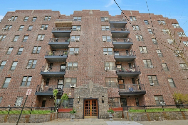 view of property with a wall mounted air conditioner