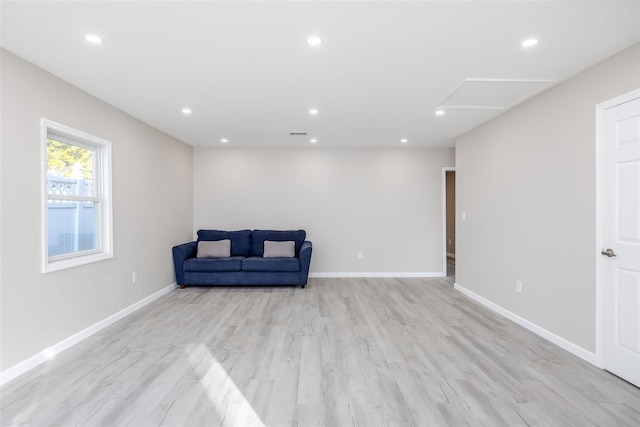 living area with light hardwood / wood-style flooring