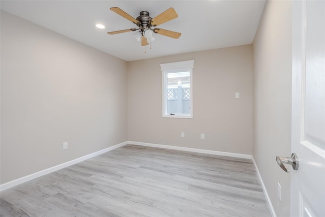 empty room with light hardwood / wood-style floors and ceiling fan