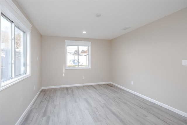 empty room with light wood-type flooring