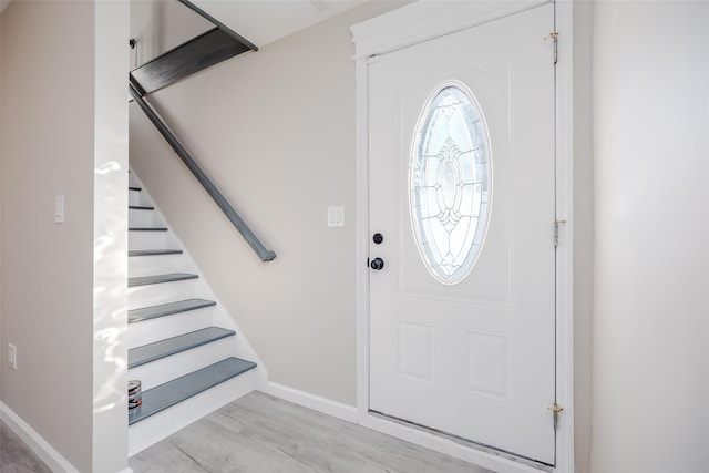 foyer entrance with light hardwood / wood-style floors