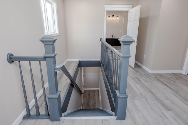 stairway with wood-type flooring