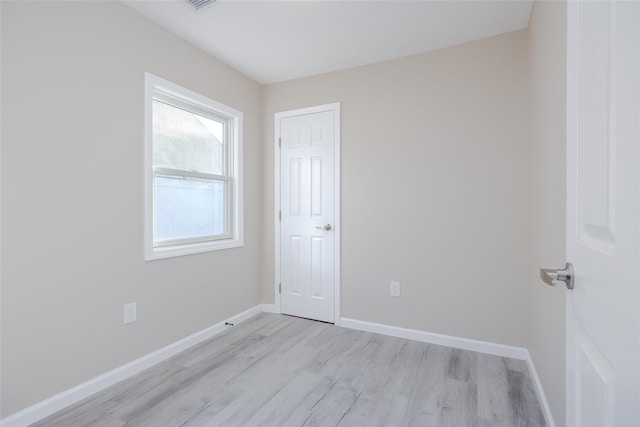 unfurnished room featuring light wood-type flooring