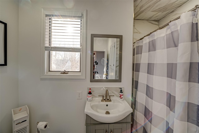 bathroom with vanity and walk in shower