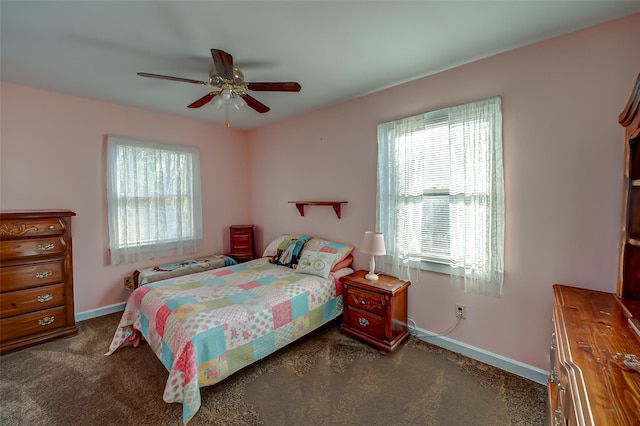 bedroom with dark carpet and ceiling fan