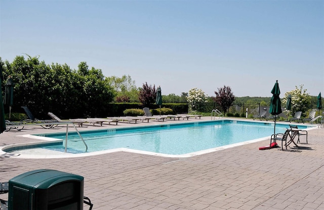 view of swimming pool with a patio area